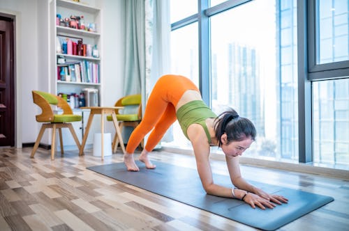 A woman in dolphin pose. Here's your daily horoscope for January 4 2022.
