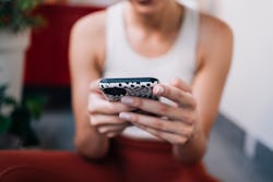 Woman holding her phone