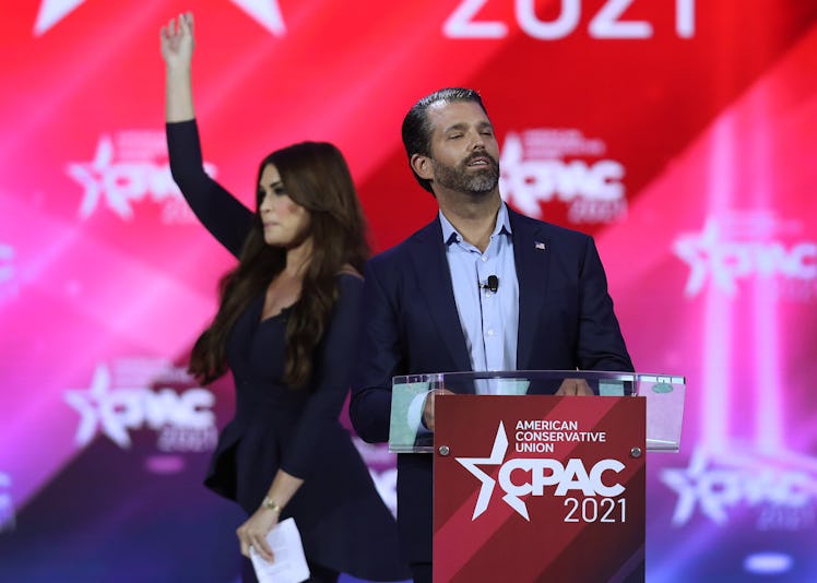 Don Trump, Jr. and Kimberly Guilfoyle stand on stage as they address the Conservative Political Acti...