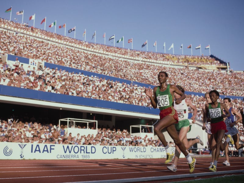 Bekele Debele #205 from Ethiopia running in the Men's 10,000 metres event at the inaugural Internat...