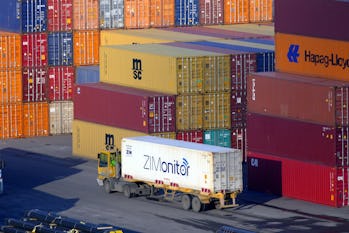 ODESA, UKRAINE - JANUARY 2, 2022 - A truck carries a shipping container on the premises of the Odesa...
