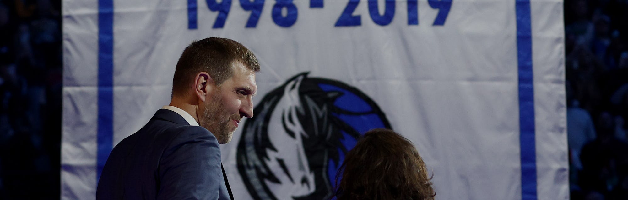 DALLAS, TEXAS - JANUARY 05: Former Dallas Mavericks player Dirk Nowitzki looks on with his wife, Jes...