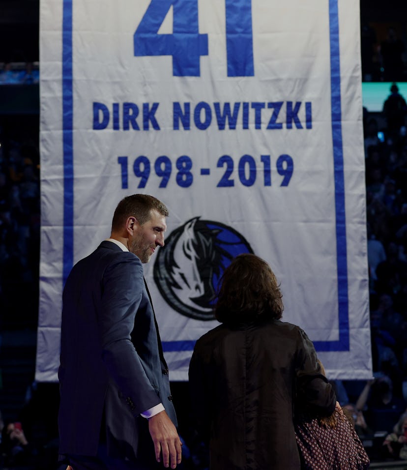 DALLAS, TEXAS - JANUARY 05: Former Dallas Mavericks player Dirk Nowitzki looks on with his wife, Jes...