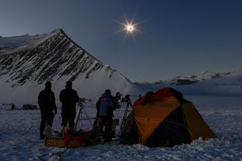 TOPSHOT - This handout picture released by Imagen Chile shows Chilean and US scientists looking at a...