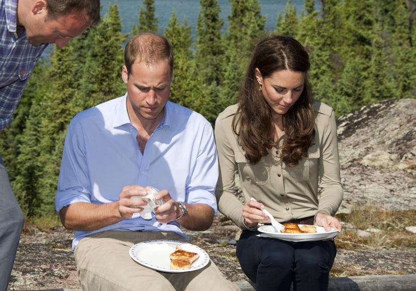 Prince William eats pizza on the couch.