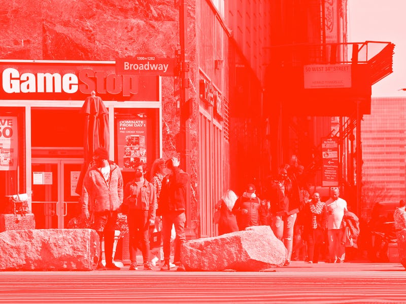 NEW YORK - NEW YORK - MARCH 23: People wait to cross the street in front of GameStop at 6th Avenue o...