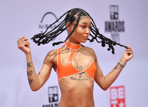Coi Leray made jumbo knotless box braids with curly ends one of the most popular protective hairstyl...