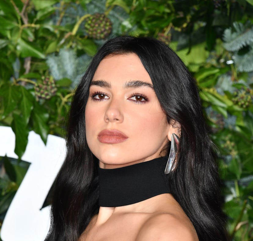Dua Lipa with brown, long hair at The Fashion Awards 2021 on November 29, 2021.