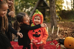 Playful kids enjoying a Halloween party baby's first halloween captions