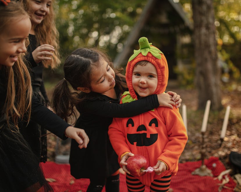 Playful kids enjoying a Halloween party baby's first halloween captions