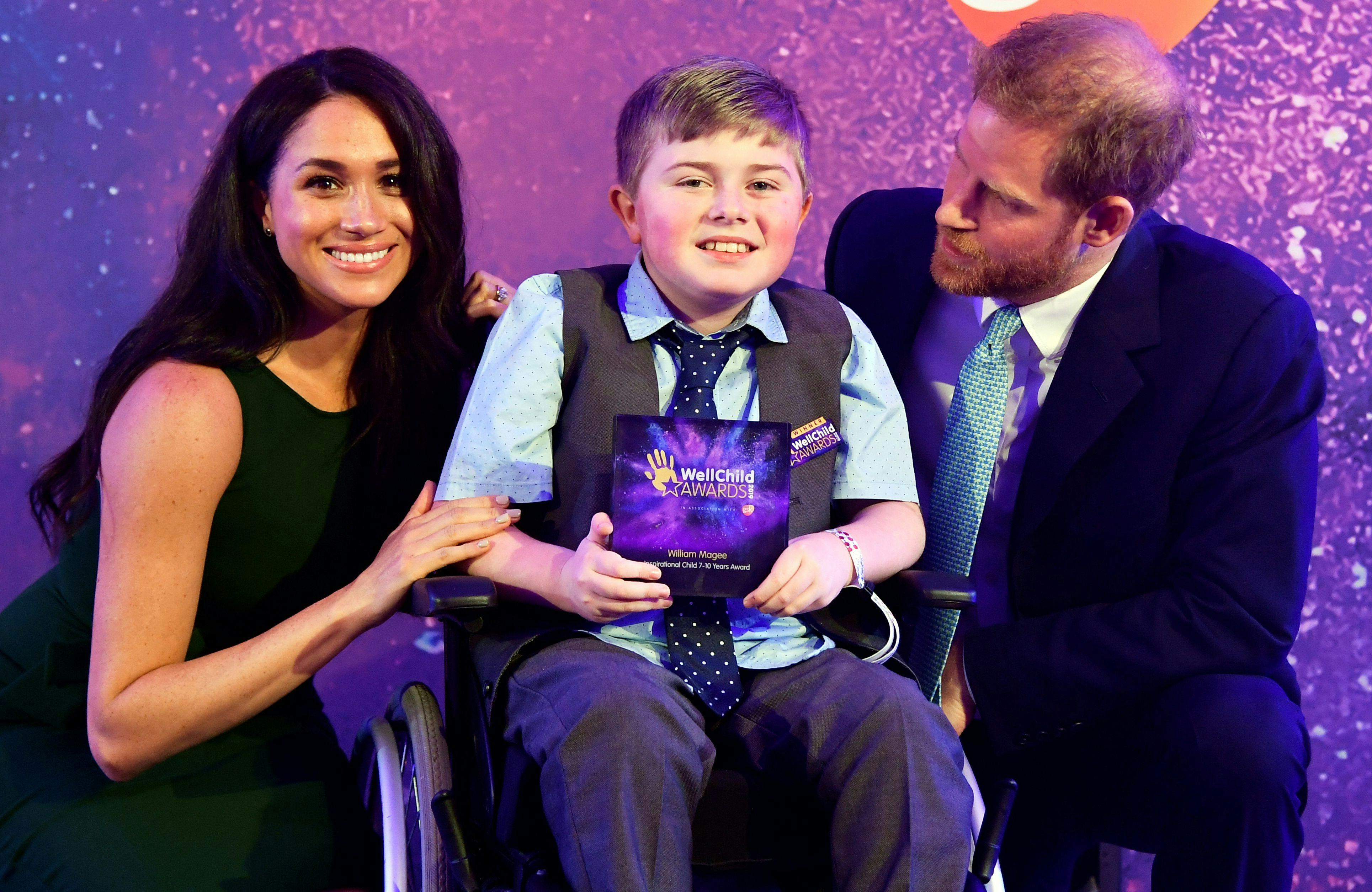Prince Harry and Meghan Markle with William Magee at the 2019  WellChild Awards.