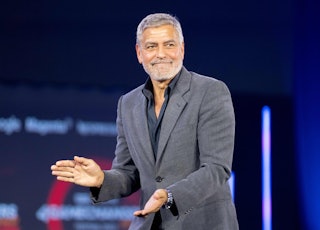 American actor and human rights activist George Clooney reacts on stage during the 4GAMECHANGERS dig...