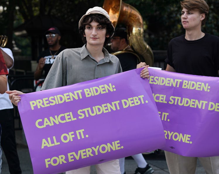Student loan debt holders take part in a demonstration outside of the white house staff entrance to ...
