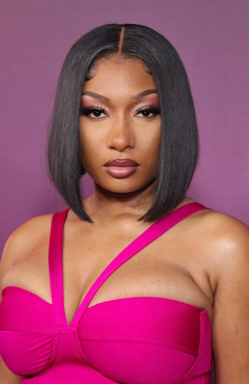 Megan Thee Stallion recently wore her hot-red hair in a spiky bun & green eyeshadow. The Y2K-inspire...