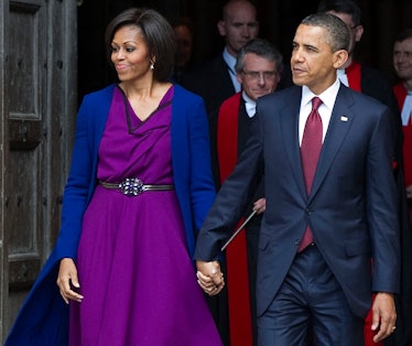 US President Barack Obama (R) and First Lady Michelle Obama leave after a tour of Westminster Abbey ...