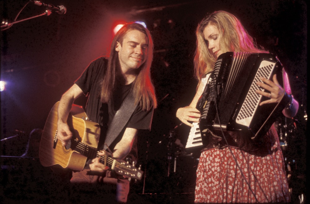 Musicians Brad Roberts and Ellen Reid are shown performing on stage during a "live" concert appearan...