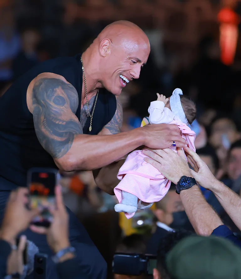 Guy Rocking A Baby Let's All Crowdsurf Our Babies To The Rock