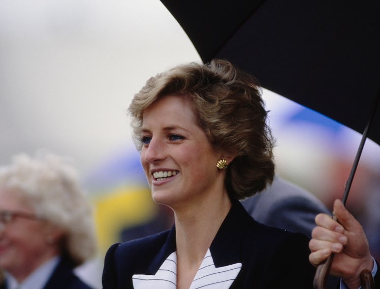 Princess Diana wearing a black and white suit by Catherine Walker, attends the start of a Pentathlon...