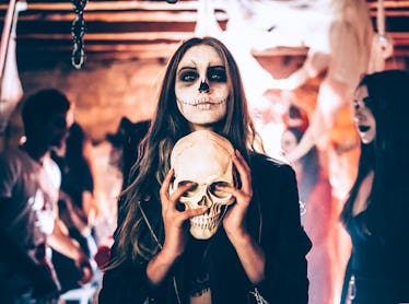 Young woman with Halloween makeup uses horror puns to caption her creepy Instagram pics.