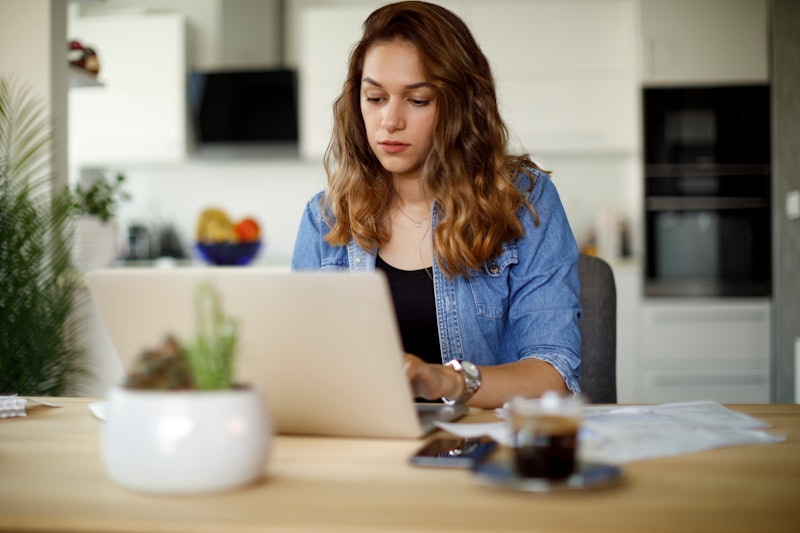 Woman paying her utility bills online