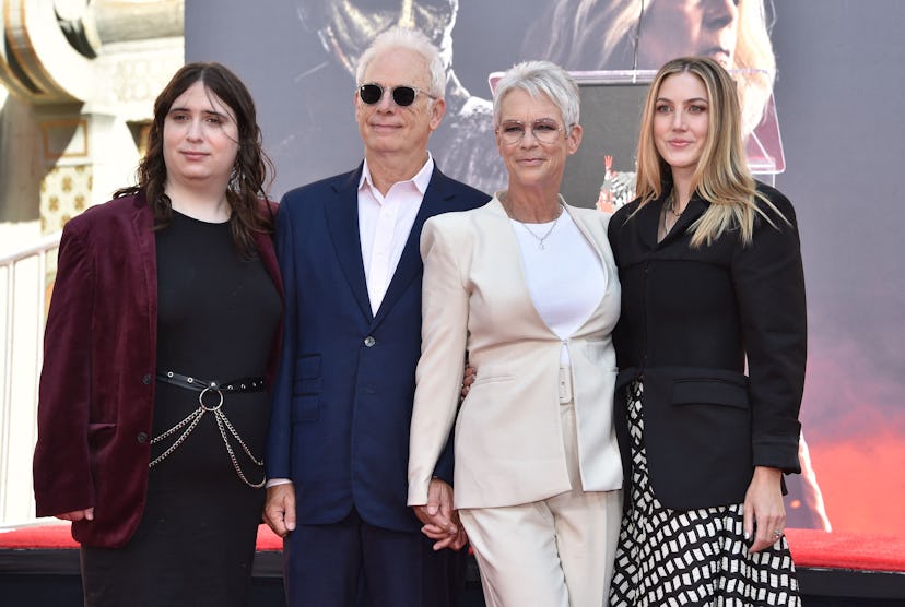 US actress Jamie Lee Curtis (2R) stands for a photo with her husband Christopher Guest, and her daug...