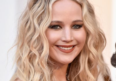 Jennifer Lawrence with tight curls and smoky makeup at the 2018 Oscars