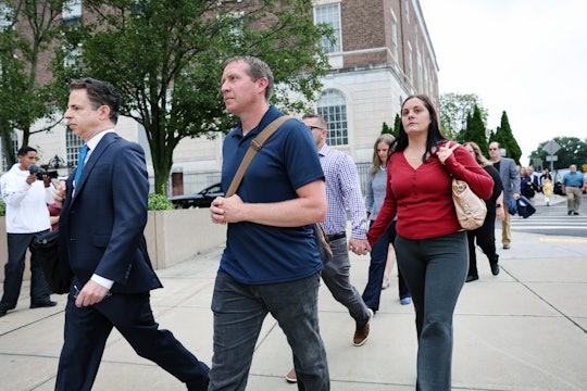 Families of Sandy Hook Elementary School shooting victims walk into Waterbury Superior Court with th...