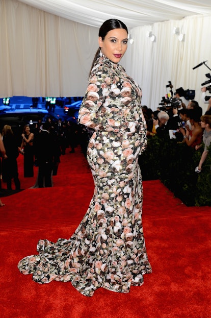 Kim Kardashian wears a floral high-neck gown as part of Kim Kardashian's style evolution