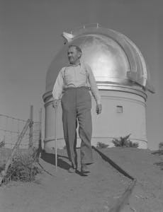 (Original Caption) Professor Fritz Zwicky, famed Swiss astronomer and 18-inch Schmidt Telescope on P...