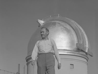 (Original Caption) Professor Fritz Zwicky, famed Swiss astronomer and 18-inch Schmidt Telescope on P...