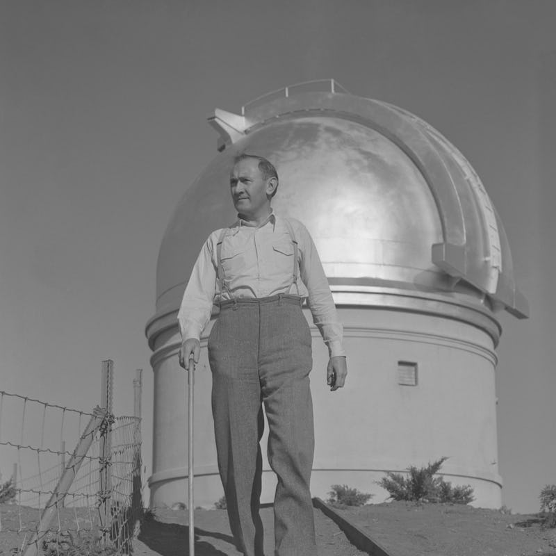 (Original Caption) Professor Fritz Zwicky, famed Swiss astronomer and 18-inch Schmidt Telescope on P...