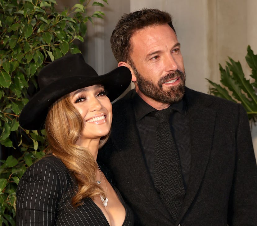 Jennifer Lopez and Ben Affleck wear matching outfits while attending the Ralph Lauren SS23 Runway Sh...
