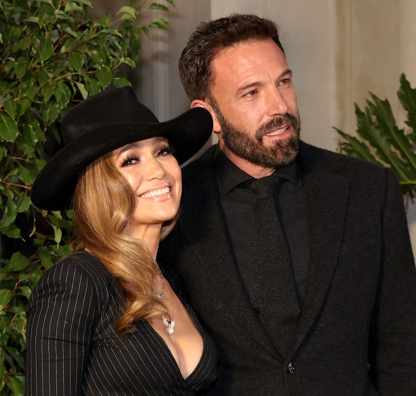 Jennifer Lopez and Ben Affleck wear matching outfits while attending the Ralph Lauren SS23 Runway Sh...