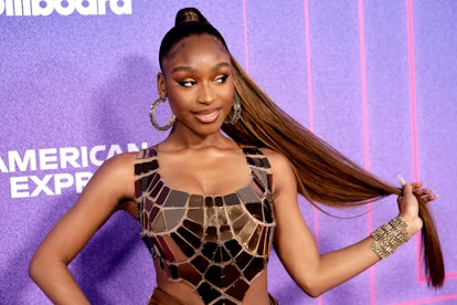 Normani holds her pumpkin cinnamon hair while she attends the 2022 Billboard Women In Music at YouTu...