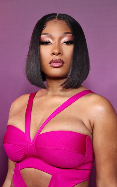 Megan Thee Stallion wears a hot pink dress