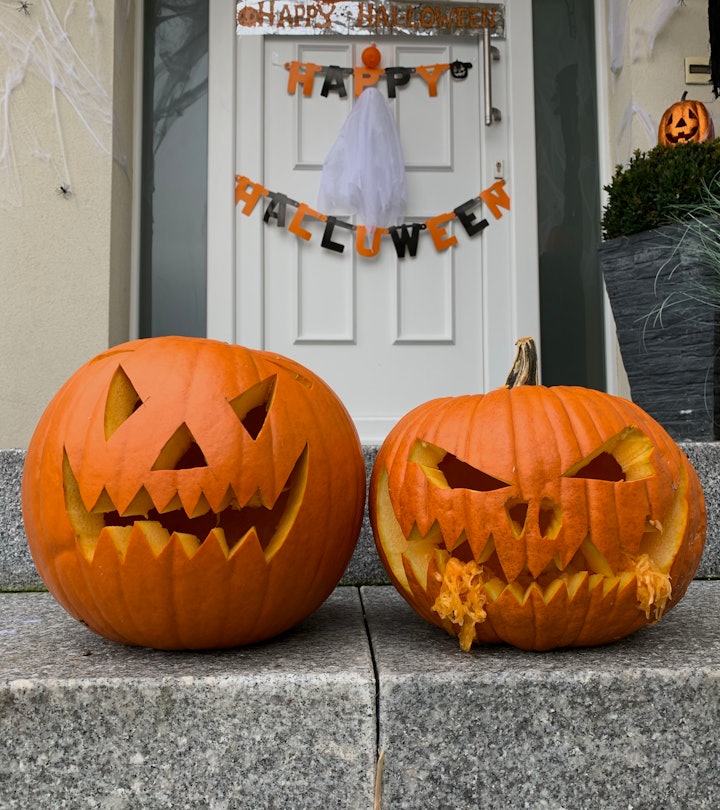 Front porch steps with carved festive pumpkins, demonstrating how to make your carved pumpkin last l...