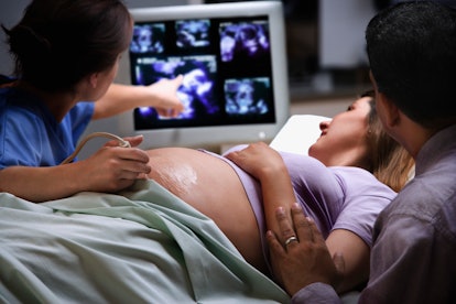 pregnant person getting an ultrasound to measure amniotic fluid levels