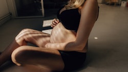 Portrait of a pregnant woman in an article about if it is OK to have sex doggy style pregnant.