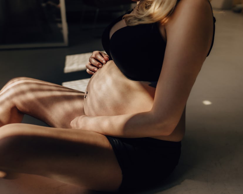 Portrait of a pregnant woman in an article about if it is OK to have sex doggy style pregnant.