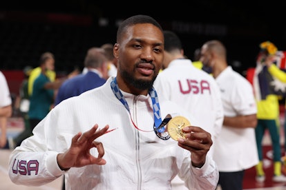 Damian Lillard #6 of Team United States poses for photographs with his gold medal  during the Men's ...