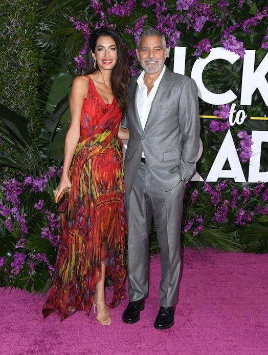 amal Clooney and George Clooney arrives at the Premiere Of Universal Pictures' "Ticket To Paradise" 