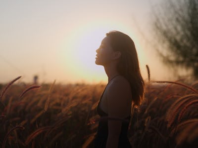 A portrait of a young woman during in nature