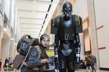 Cosplayers dressed as Bodhi Rook and K-2SO attend Star Wars Celebration at McCormick Place Conventio...
