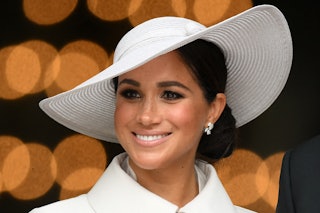 Britain's Meghan, Duchess of Sussex, smiles a she leaves after attending the National Service of Tha...