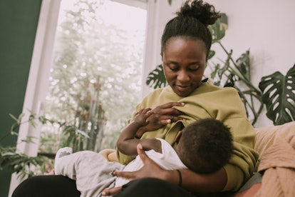 Woman breastfeeding in article about breastfeeding and fenugreek 