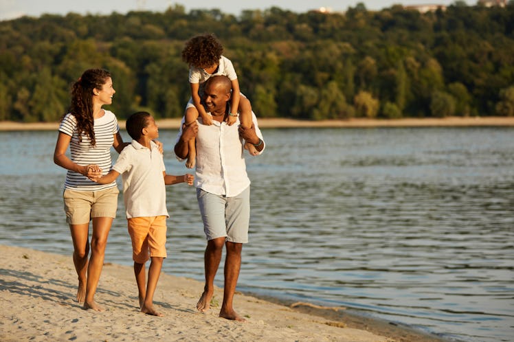Beautiful family walking on the beach