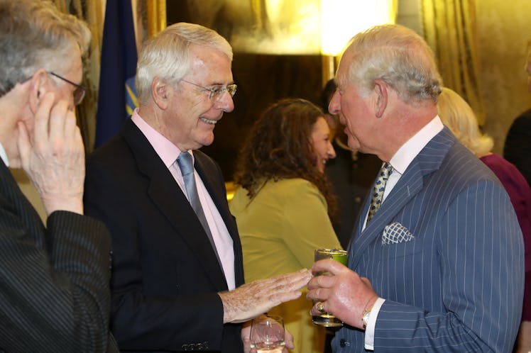 Prince Charles speaks with former Prime Minister John Major.