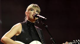 Taylor Swift performs onstage with glittering nails during NSAI 2022 Nashville Songwriter Awards at ...