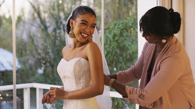 Cropped shot of a happy young bride bonding with her mother-in-law while she gets ready for her wedd...