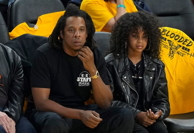 Rapper Jay-Z and his daughter Blue Ivy Carter look on during the second quarter of Game Five of the ...